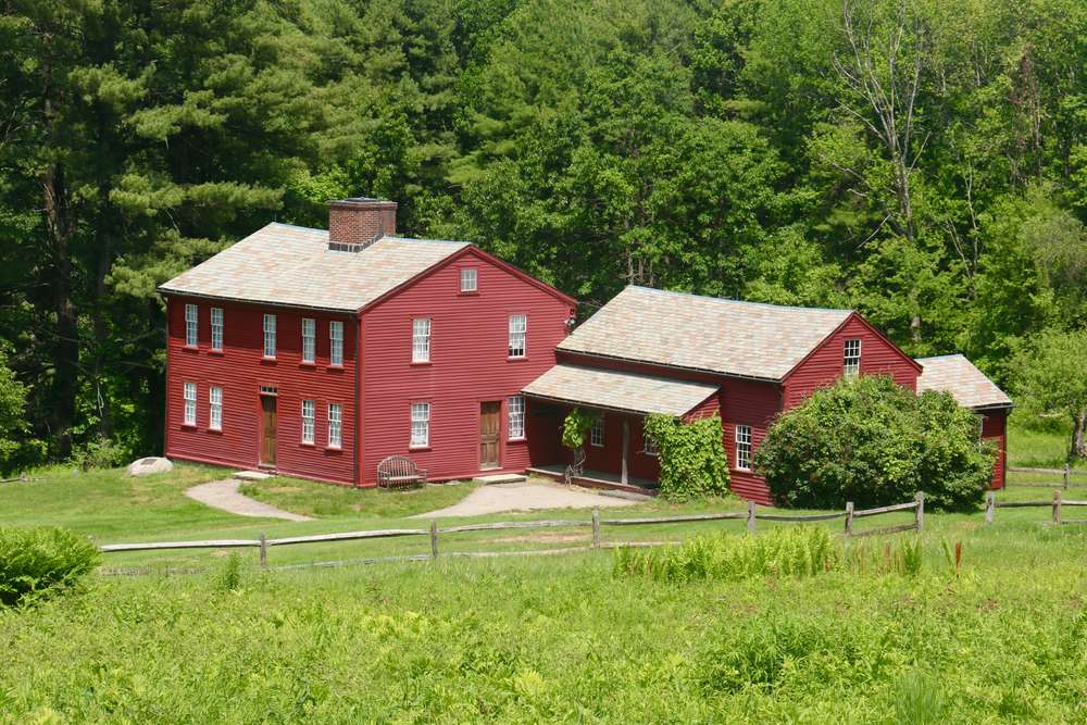 Beautiful farm in Harvard MA with a large red wooden home on the property