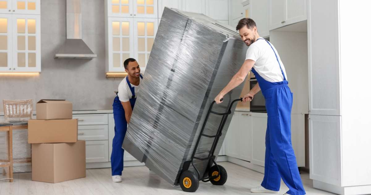 Oxford MA movers moving a fridge. 