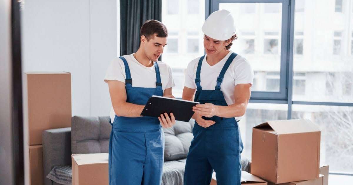 Two professionals from a moving company in Holden MA looking over a moving checklist