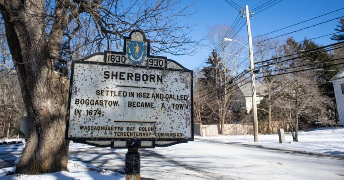 A historical marker in the Town of Sherborn during the wintertime