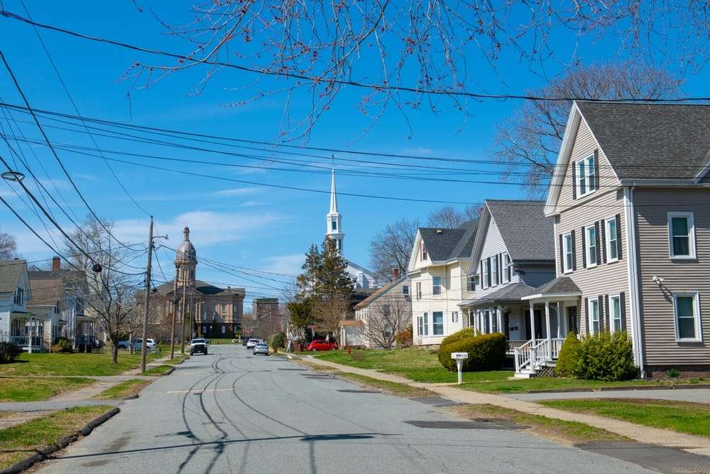 Rows of houses with a historic church in the background